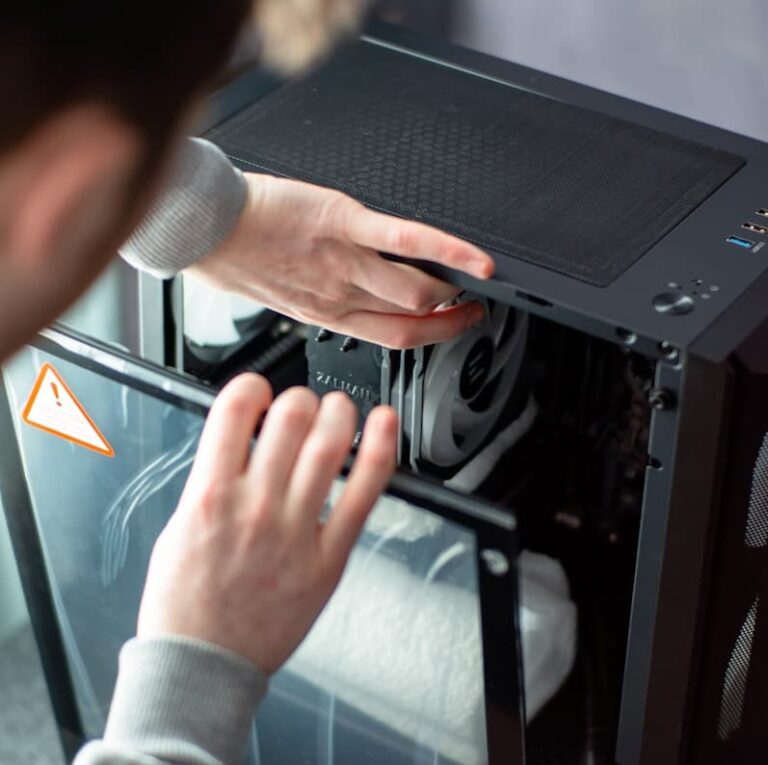A person is working on a computer in a room